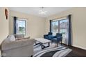 Comfortable sitting room with large windows, natural light, and stylish decor at 3748 Pawnee Trl, Columbus, IN 47203