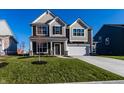 Beautiful two-story home with a combination of siding, stone accents, and a well-manicured lawn at 4068 Bozeman Way, Bargersville, IN 46106