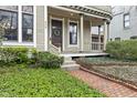 Inviting front porch featuring a decorative wreath and a brick pathway at 434 E New York St, Indianapolis, IN 46202