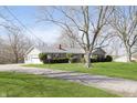 Ranch home with attached garage and well-manicured lawn at 5913 W Maple Dr, Frankton, IN 46044