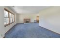 Spacious living room with a brick fireplace and ample natural light at 5913 W Maple Dr, Frankton, IN 46044