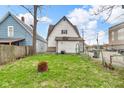 Spacious backyard featuring a grassy lawn and a partial fence at 953 N Oakland Ave, Indianapolis, IN 46201