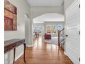 Welcoming foyer featuring hardwood floors and an open view to the dining and living areas at 10603 Hinterland Dr, Fishers, IN 46038