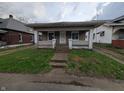 Modest single-story home with a covered front porch and small front yard at 1524 Ohio Ave, Anderson, IN 46016