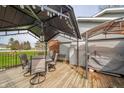 Outdoor deck featuring string lights, a grill, and nice dining furniture perfect for entertaining guests at 16371 State Road 38 E, Noblesville, IN 46060