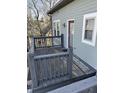 Private porch with wooden decking and railing, perfect for relaxing outdoors at 2250 N Pennsylvania St # 8, Indianapolis, IN 46205