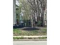 Neatly landscaped yard with dark mulch and a view of fencing at 2250 N Pennsylvania St # 8, Indianapolis, IN 46205