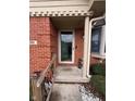 Inviting front entrance with red brick, white trim, and decorative foliage at 2856 Colony Lake East Dr, Plainfield, IN 46168