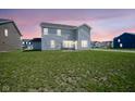 Spacious backyard with a large grass area, perfect for outdoor activities and relaxation at 7140 Leatherwood Dr, Indianapolis, IN 46259