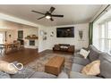 Cozy living area with fireplace, ceiling fan, and comfortable seating at 7915 Allisonville Rd, Indianapolis, IN 46250