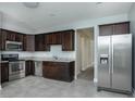 Modern kitchen with stainless steel appliances, granite countertops, and dark cabinetry at 804 N California St, Indianapolis, IN 46202