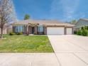 Inviting single-story brick home with a neatly maintained lawn and a wide driveway at 9831 N Port Dr, McCordsville, IN 46055
