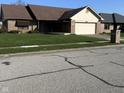 Well-maintained single-Gathering home with a two-car garage and a meticulously kept lawn at 1010 Pamela Dr, Plainfield, IN 46168
