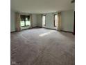 Bright living room with neutral walls, large windows and plush carpeting at 1010 Pamela Dr, Plainfield, IN 46168