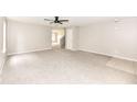 Spacious living room featuring plush carpeting and a ceiling fan at 12455 Deerview Dr, Noblesville, IN 46060