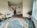Cozy living area showcasing a stylish rug, comfortable seating, and ample natural light at 1336 Danielle Rd, Lebanon, IN 46052