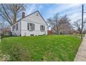 A side view of the house with a well-manicured lawn and nice curb appeal at 1441 N Euclid Ave, Indianapolis, IN 46201