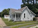 Side view of the exterior highlighting the architectural style, neat landscaping, and the home's overall curb appeal at 159 N Lincoln St, Martinsville, IN 46151