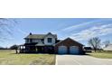 Charming home with a long driveway, two-car garage, and lots of curb appeal at 1687 E 600 N, Whiteland, IN 46184