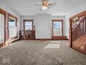 Empty living room with traditional millwork and staircase at 2083 E 750 S, Flat Rock, IN 47234