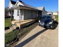 This single-story home features a covered porch and convenient parking in the driveway at 2111 Central Ave, Anderson, IN 46016