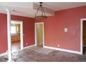 Spacious living room with a chandelier and doorways to other rooms at 2811 S Elm St, Muncie, IN 47302