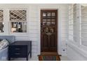 Inviting front door and entry with sidelight window and white brick wall at 4030 N Illinois St, Indianapolis, IN 46208