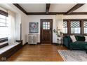 Cozy living room with hardwood floors, dark wood trim, and stylish furniture at 4030 N Illinois St, Indianapolis, IN 46208
