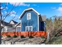 Exterior view of charming blue two-story home and landscaped yard at 424 N Randolph St, Indianapolis, IN 46201