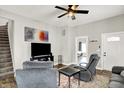 Comfortable living room with cozy seating, ceiling fan, and natural light at 424 N Randolph St, Indianapolis, IN 46201