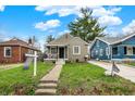 Well-maintained home with a manicured lawn and inviting curb appeal at 4721 Ralston Ave, Indianapolis, IN 46205