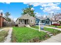 Quaint house with beautiful landscaping and a long driveway at 4721 Ralston Ave, Indianapolis, IN 46205