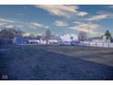 Expansive backyard with shed, partially fenced in, and a view of mature trees at 535 Butterfly Cir, Greenwood, IN 46142