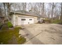 Exterior shot of garage, patio, and driveway at 5918 Camelback Ct, Indianapolis, IN 46250