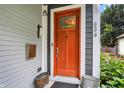 Welcoming front door with sidelights, enhanced by stylish exterior details and lush landscaping at 634 Dorman St, Indianapolis, IN 46202