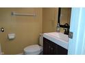 Cozy half bathroom with modern vanity, sink, and fixtures at 7809 Bryden Dr, Fishers, IN 46038
