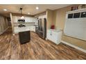 Updated kitchen featuring stainless steel appliances, granite countertops, and a kitchen island at 7809 Bryden Dr, Fishers, IN 46038