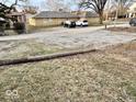 Gravel backyard and parking area, with utility pole visible at 921 W Carson St, Muncie, IN 47303