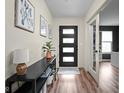 Welcoming entryway with modern decor, a console table, and a view into the living spaces at 1024 Cyprian Way, Lebanon, IN 46052