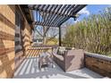 Cozy covered patio with a comfortable seating area, perfect for relaxation and outdoor enjoyment at 1025 E 60Th St, Indianapolis, IN 46220