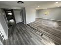 Spacious living room with grey walls, vinyl flooring, recessed lighting, and natural light at 1308 W 18Th St, Indianapolis, IN 46202