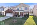 Lovely two-story home with a well-maintained lawn, attached two-car garage, and a welcoming front entrance at 1907 Wedgewood Pl, Avon, IN 46123