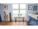 Cozy living room with plenty of natural light, hardwood floors, and comfortable furniture at 3004 Lake Shore Dr # E, Indianapolis, IN 46205