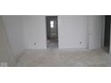 Bright, unfinished bedroom with freshly painted white walls, doors and baseboards at 3941 Highcrest Rd, Indianapolis, IN 46239