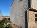 Exterior view showcasing the home's siding and brickwork, highlighting its architectural details at 480 Village Blvd, Mooresville, IN 46158