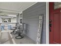 Inviting front porch with outdoor seating, creating a relaxing and welcoming space for guests at 4815 Winthrop Ave, Indianapolis, IN 46205