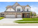Charming two-story home with a well-kept lawn and a three car garage, perfect for a growing Gathering at 4960 Cinnabar Trl, Brownsburg, IN 46112