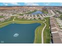 Panoramic aerial view of a beautiful community featuring a pond with fountains, green spaces, and winding walking paths at 622 Ehrlich Ln, Westfield, IN 46074