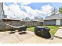 Relaxing backyard with hammock, patio set, grill and string lights at 64 Central Greens Blvd, Indianapolis, IN 46222