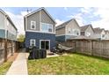 Spacious backyard with patio, grill, hammock, and well-maintained lawn at 64 Central Greens Blvd, Indianapolis, IN 46222